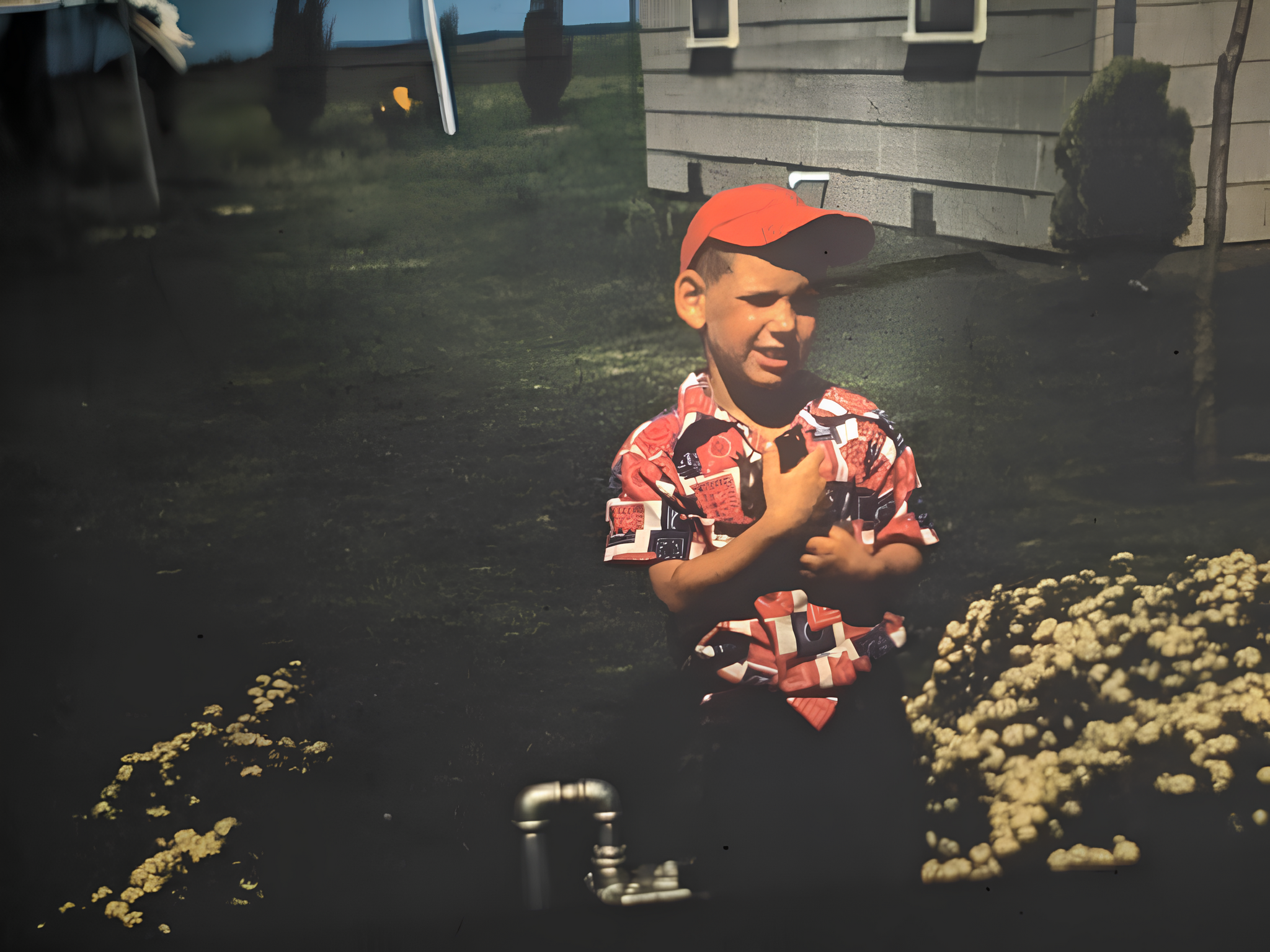 Tom holding a baby raccoon