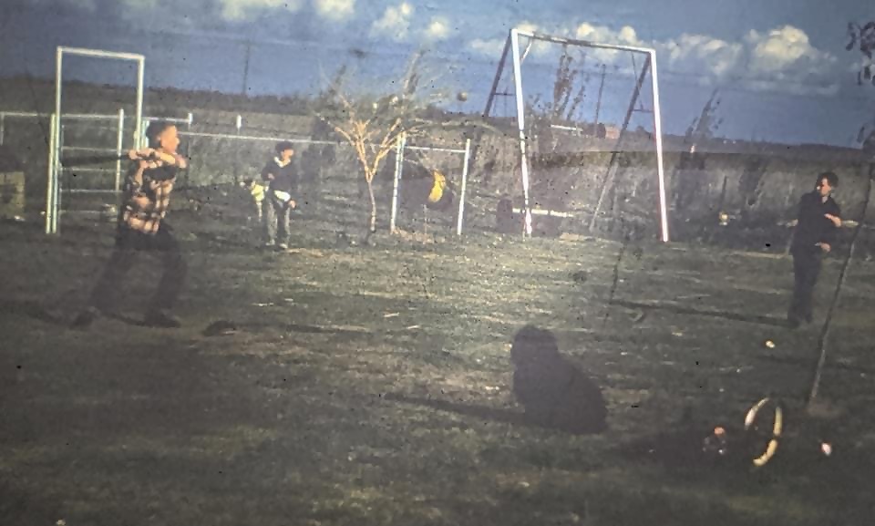 Backyard baseball in Chase.  Tom is on deck (hat and sweater).