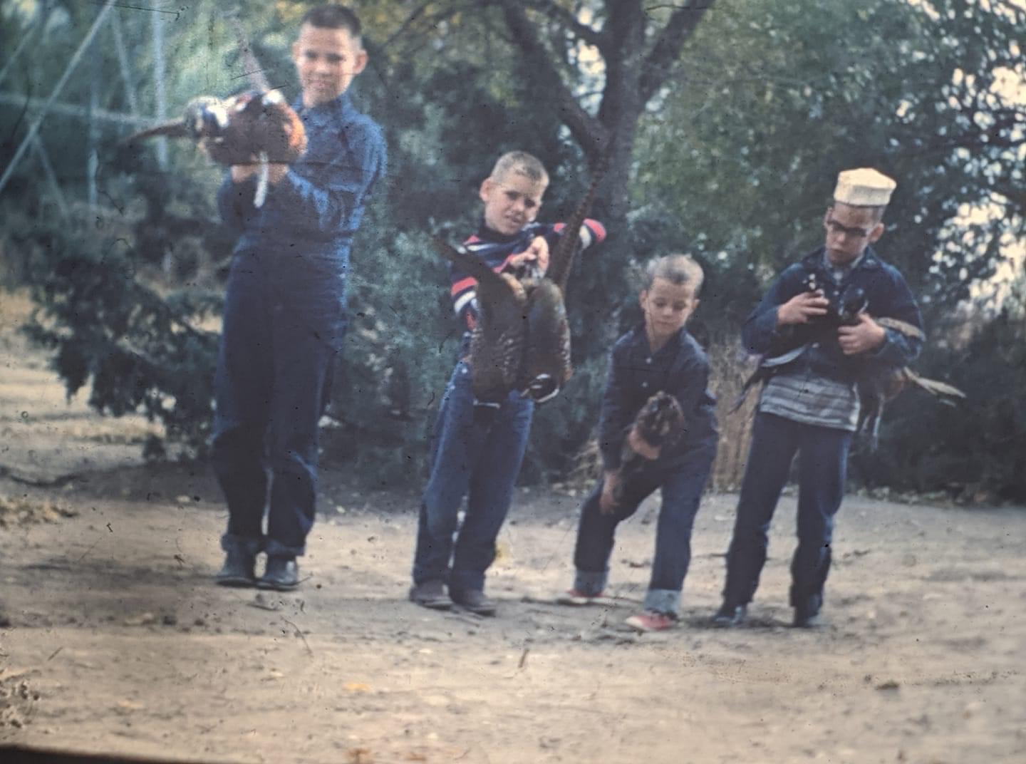 Curt, Tom, Randy Fischer, Bill.  Pheasant hunters.